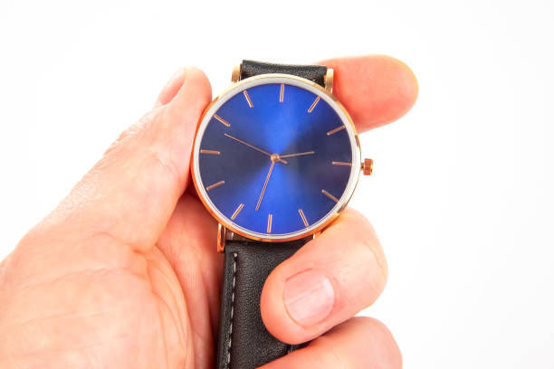 istock Wristwatch in hand on a white background 1469564327
