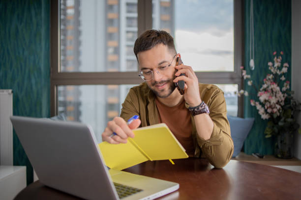 istock Young fashionable man working at home 1469564632