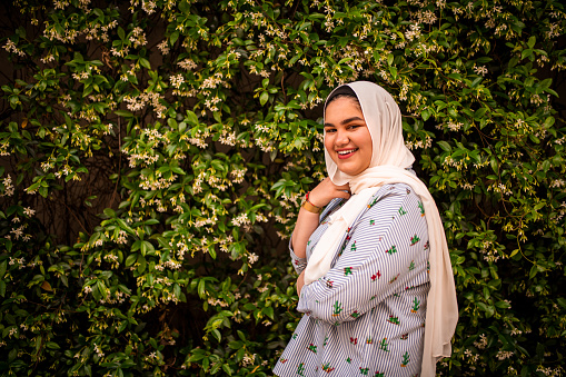 Portrait of a smiling Muslim teenager looking at the camera