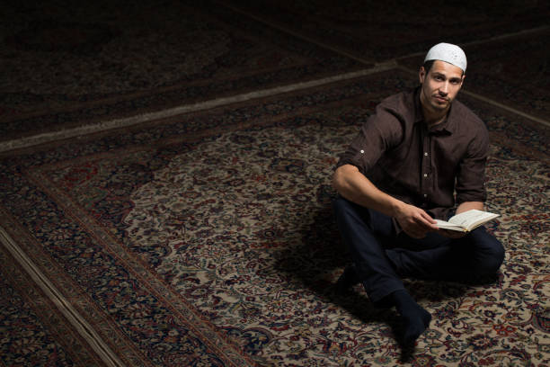 istock Muslim Man Is Reading The Koran 1469566478