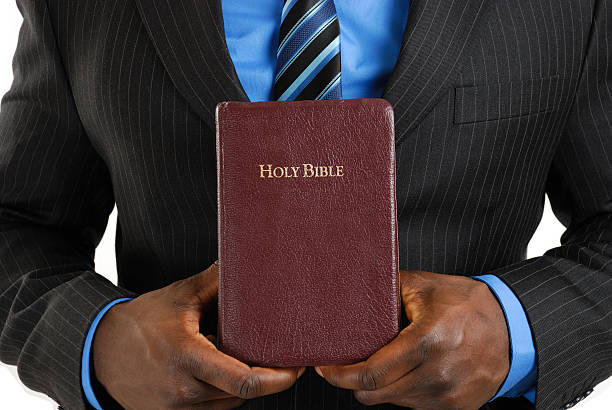 istock Business man holding a bible 146956782