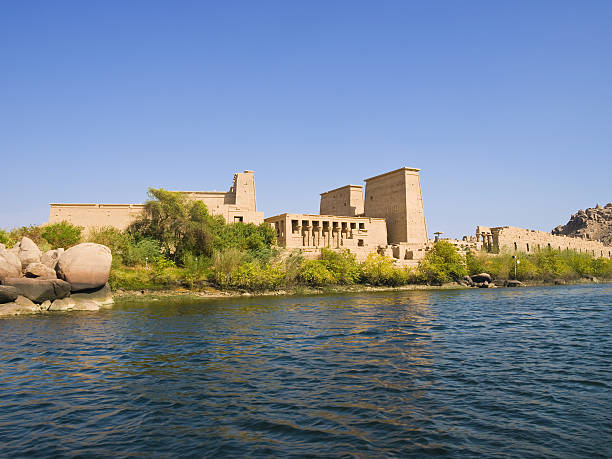 Isis temple View of Philae Island from a boat on Nasser lake. Egypt series temple of philae stock pictures, royalty-free photos & images