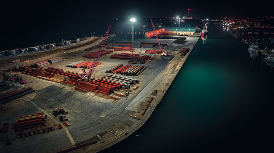 Aerial view of an industrial estate and port with warehouse at night