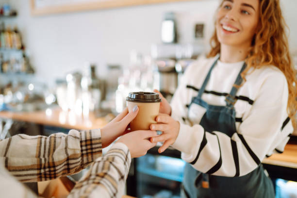 istock Female barista making coffee in a coffee machine. 1469568646