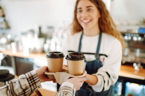 istock Female barista making coffee in a coffee machine. 1469568656
