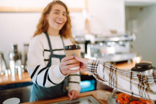 istock Female barista making coffee in a coffee machine. 1469568660