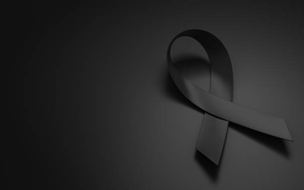 Awareness black strip folded, sitting on the black floor