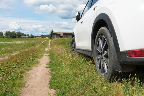 istock white car stands on the side of  road 1469580042