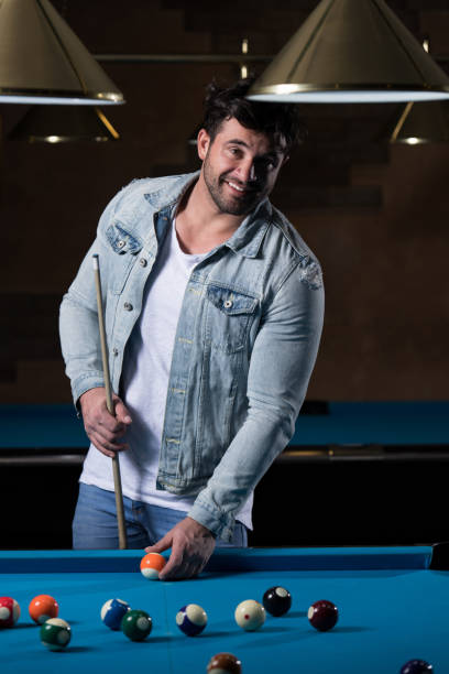 istock Portrait Of A Young Man Playing Billiards 1469583376