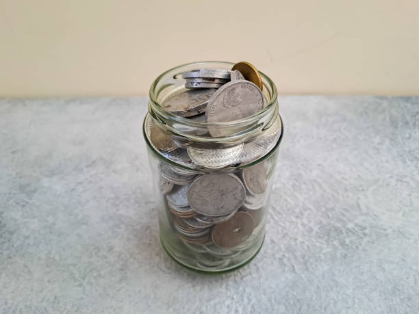 istock Coins in glass jar 1469585881