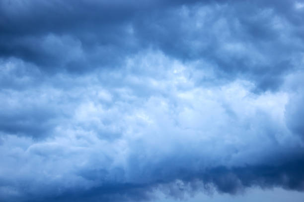istock Light in the dark and dramatic storm clouds. Stormy clouds in the dark sky. 1469587121