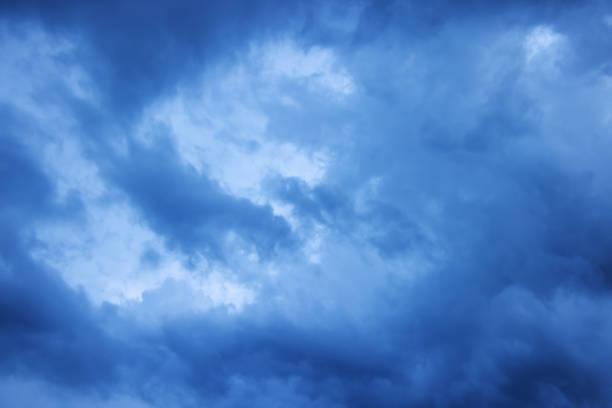istock Light in the dark and dramatic storm clouds. Stormy clouds in the dark sky. 1469587214