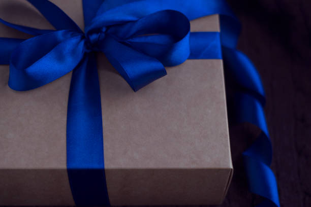 istock Gift crafted box with blue ribbon bow 1469595500