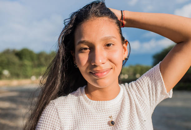 Young woman outdoors enjoying the river in the Cauca Valley of Colombia