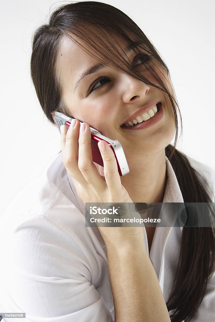 Junge Frau spricht über cellphone - Lizenzfrei Attraktive Frau Stock-Foto