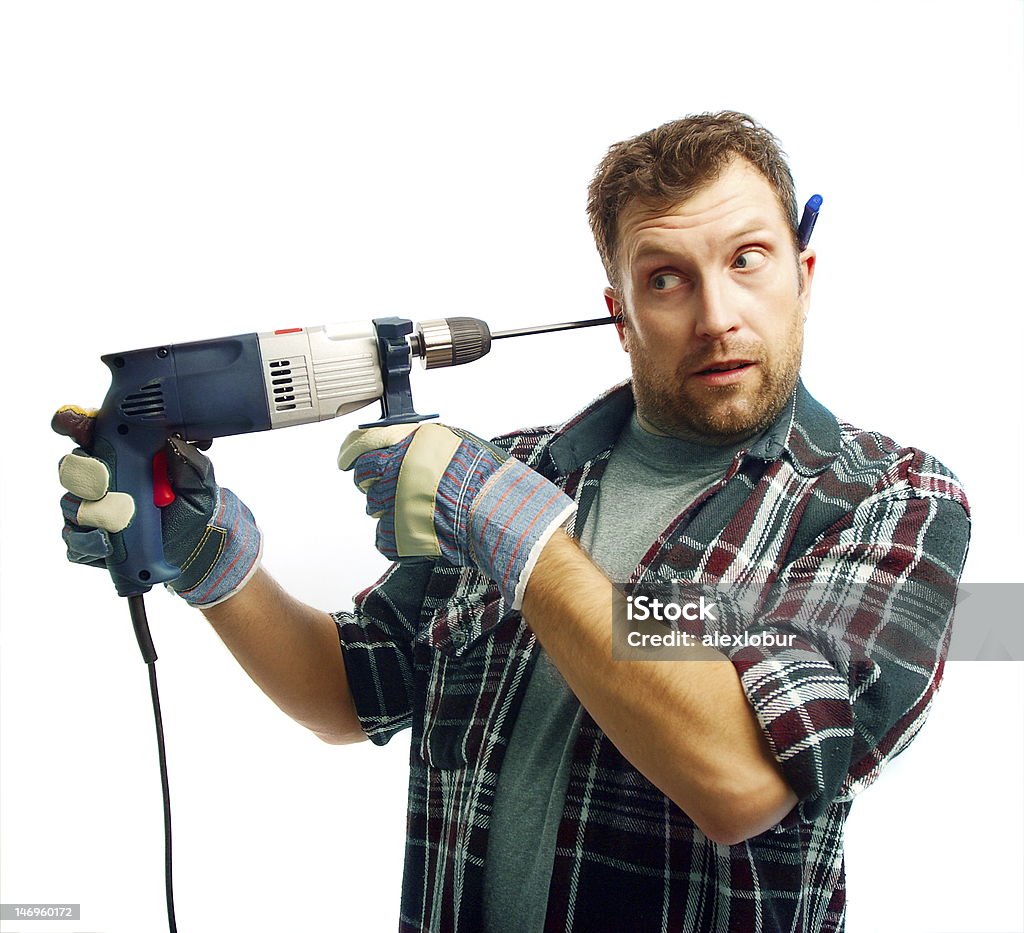 Funny workman con brocas de rectificación de su oído - Foto de stock de Aburrimiento libre de derechos