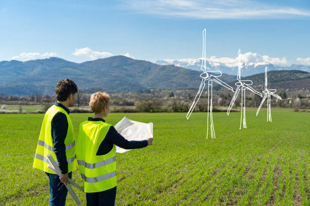 istock Two engineers imagine a new wind turbines in remote location 1469602566