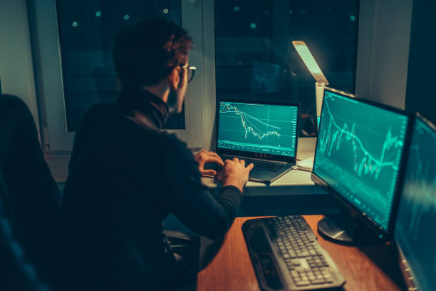 istock Nighttime Analysis Guy Typing on Laptop at Home Office 1469602593