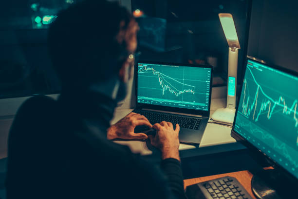 istock Financial Focus Male Worker Analyzing Stock Market on Computer Screen 1469602598