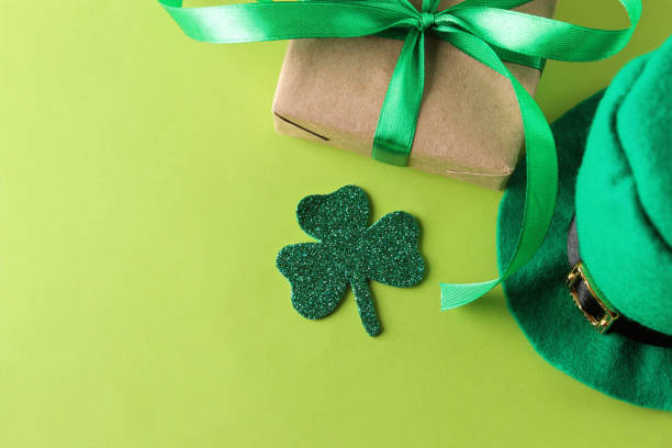 istock St.Patrick 's Day. celebration. green leprechaun hat and gift box on a bright green background. top view 1469602720