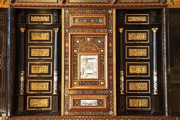 Impressive wooden and gold furniture from Chenonceau chateau.