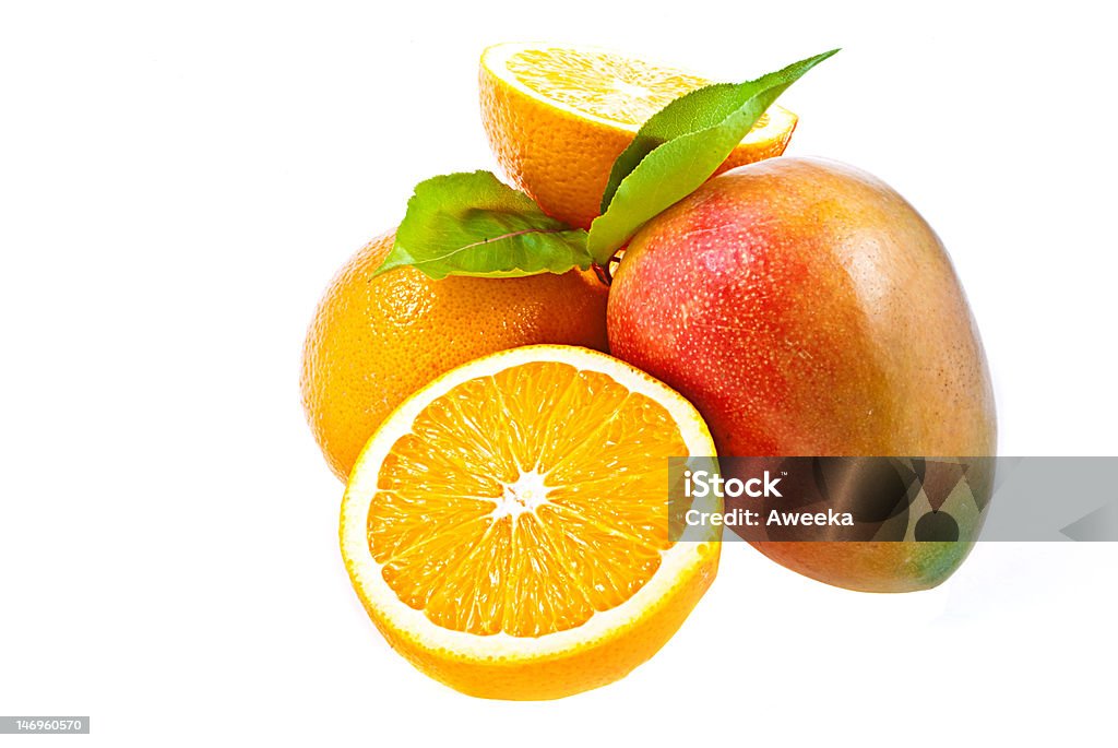 Naranjas y mango - Foto de stock de Mango - Fruta tropical libre de derechos