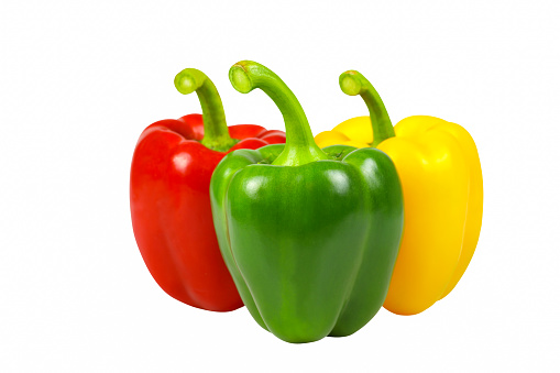 Fresh carrots and bell peppers isolated on white background