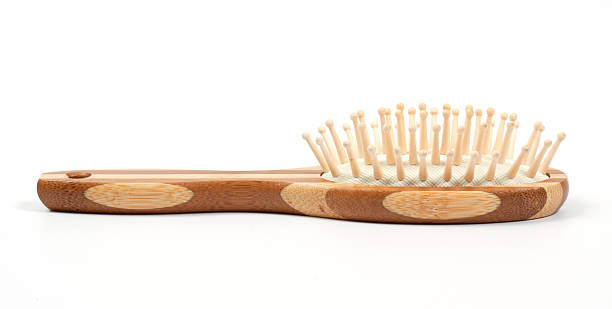 istock Wooden massage comb over white 146960885