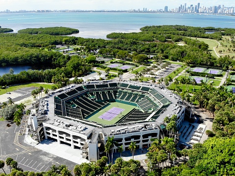 Key Biscayne, Florida, USA\nFebruary 25, 2022\nCrandon Park Tennis Center is a world-renowned tennis facility located in Key Biscayne, Florida, USA. The main stadium court named after legendary tennis player Arthur Ashe, which has a seating capacity of 13,800. Crandon Park Tennis Center has hosted numerous international tennis events, including the Miami Open, which is one of the largest tennis tournaments in the world. The facility is situated in a beautiful park that offers stunning views of the Atlantic Ocean, and it is a popular destination for tennis enthusiasts and fans of the sport.