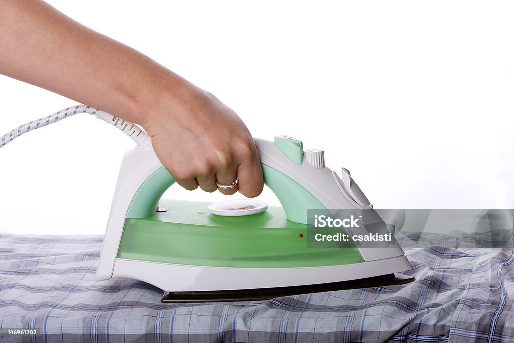 ironing woman hand ironing isolated on white Iron - Appliance Stock Photo