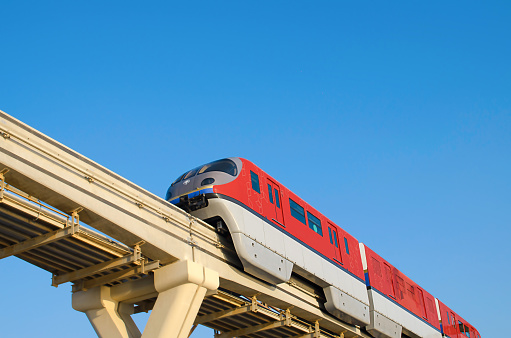 train on a monorail road on the Dubai bridge, view from below