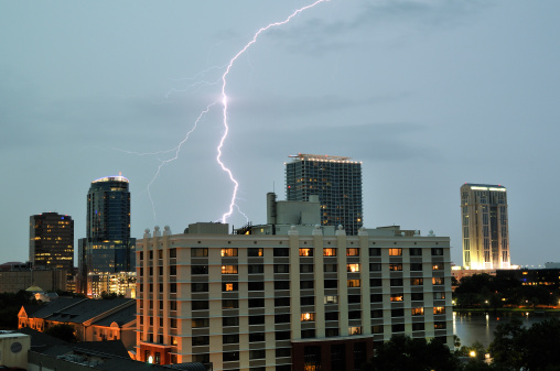 Lightning striking behind some of the buildings in Downtown Orlando, Florida