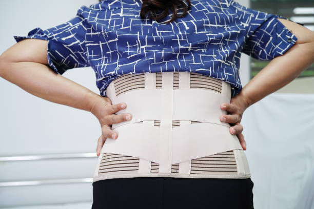 istock Asian senior wearing elastic support belt can help reduce back pain. 1469616804