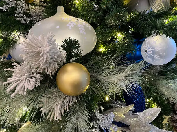 Assorted ornaments on Christmas tree.