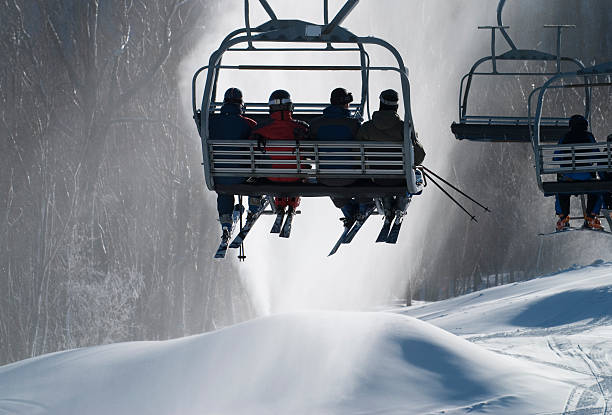 istock Skiers riding a chairlift 146961853