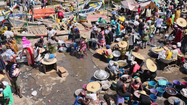 Cape Coast Ghana Elmina dock market fishing crowd boats