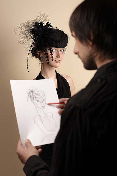 artist draws the woman stock photo