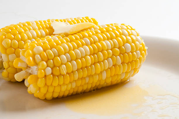 istock Sweet corn on plate with melted butter 146962028