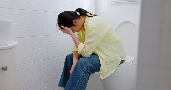 asian woman feel depression in the toilet room at home