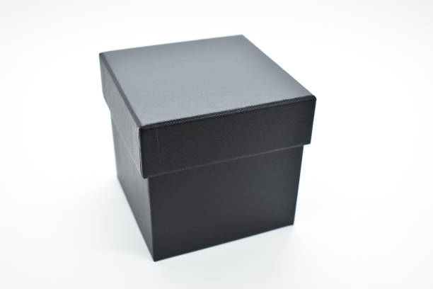 istock black paper box on white background, packaging industry 1469623814