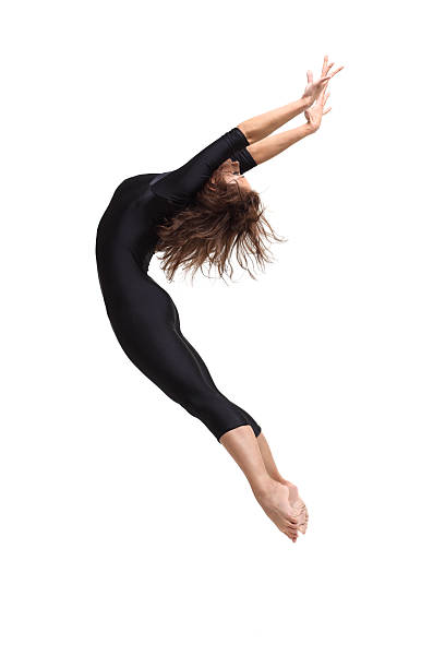 istock A flexible jumping dancer wearing all black 146962498
