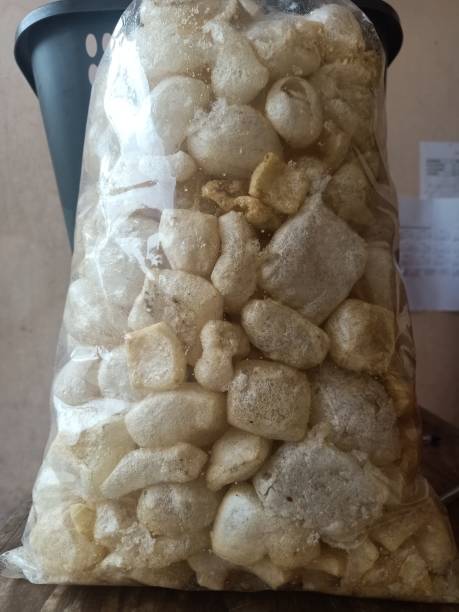 istock Cow skin crackers in a large clear plastic bag 1469628573