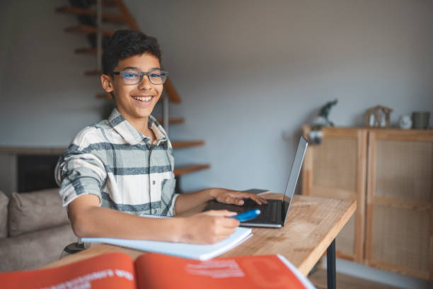 istock Boy studying online at home 1469628624