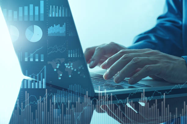 istock Analyzing business finance data. Many graphs and laptop. 1469637144