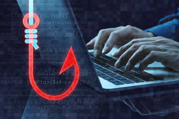 Phishing scam image. Fishhook icon and laptop. Close up of hands typing. phishing stock pictures, royalty-free photos & images