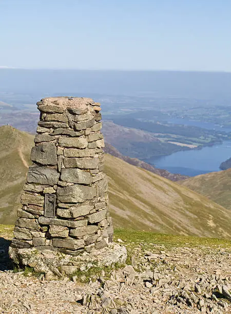 Concrete pillar or triangulation point on top of Helvellyn on an autumn day, in the Lake District, Cumbria, UK