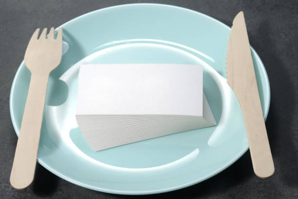 istock Blank white mock-up business cards, porcelain blue plate on dark backgound table 1469637767