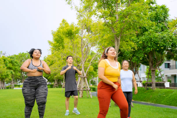 istock Group of people are going to work out at the park. 1469637925