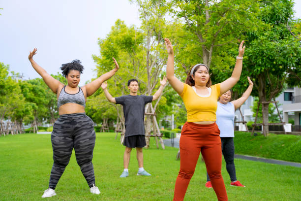 istock Group of people are going to work out at the park. 1469637945