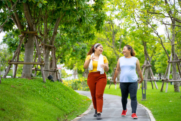 Group of people are going to work out at the park. stock photo